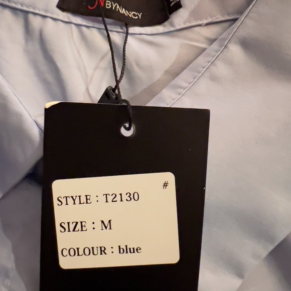 A338  Nancy  Light Blue  Sculpted Flower Detail Blouse  Oversized Fit, NWT  M - Picture 4 of 5